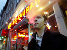 David Ozanich smoked outside the Live Bait bar in New York City in April 2003, a few months after a ban on smoking in bars and restaurants took effect. David Ozanich smoked outside the Live Bait bar in New York City in April 2003, a few months after a ban on smoking in bars and restaurants took effect.