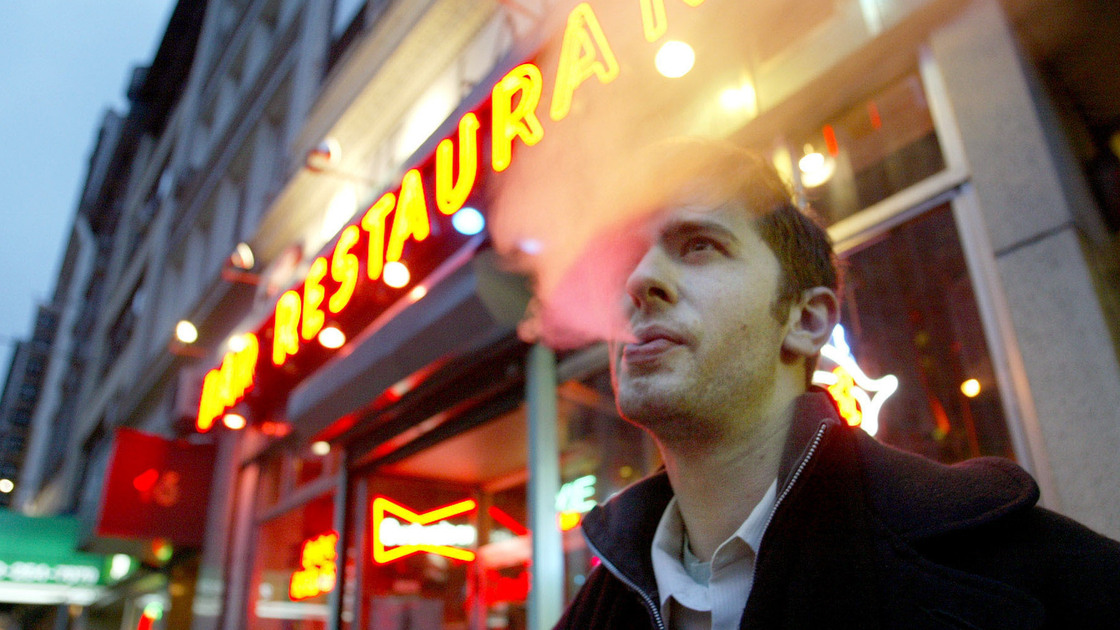 David Ozanich smoked outside the Live Bait bar in New York City in April 2003, a few months after a ban on smoking in bars and restaurants took effect.