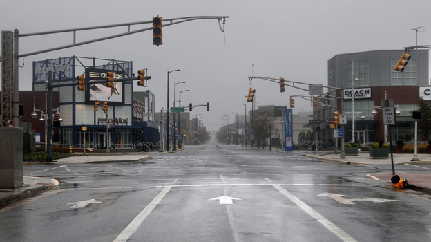 Broken and non-functional traffic lights hang over an intersection in Atlantic City, N.J., on Monday.