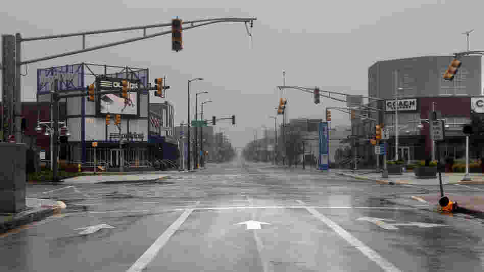 Broken and non-functional traffic lights hang over an intersection in Atlantic City, N.J., on Monday.