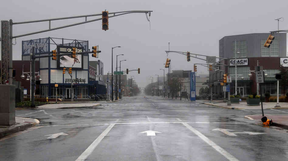 Broken and non-functional traffic lights hang over an intersection in Atlantic City, N.J., on Monday.
