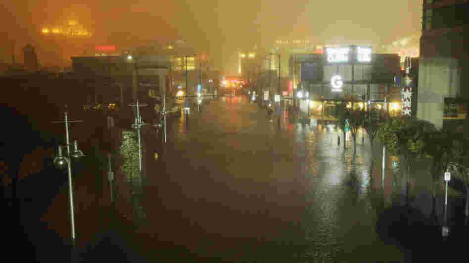 A flooded street is seen at nightfall during rains from Hurricane Sandy in Atlantic City, N.J. on Monday. Sandy made landfall over Southern New Jersey today.