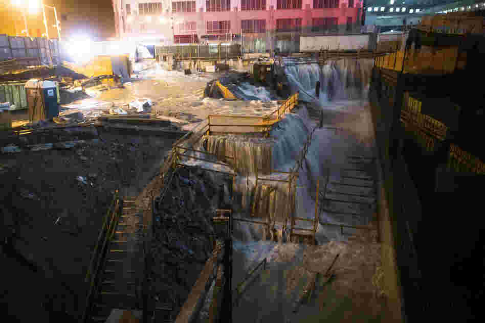 Seawater floods the ground zero construction site in New York City. The storm, which has spread rain and high winds from North Carolina to New England and west into Pennsylvania and upstate New York, continues to head northwest.