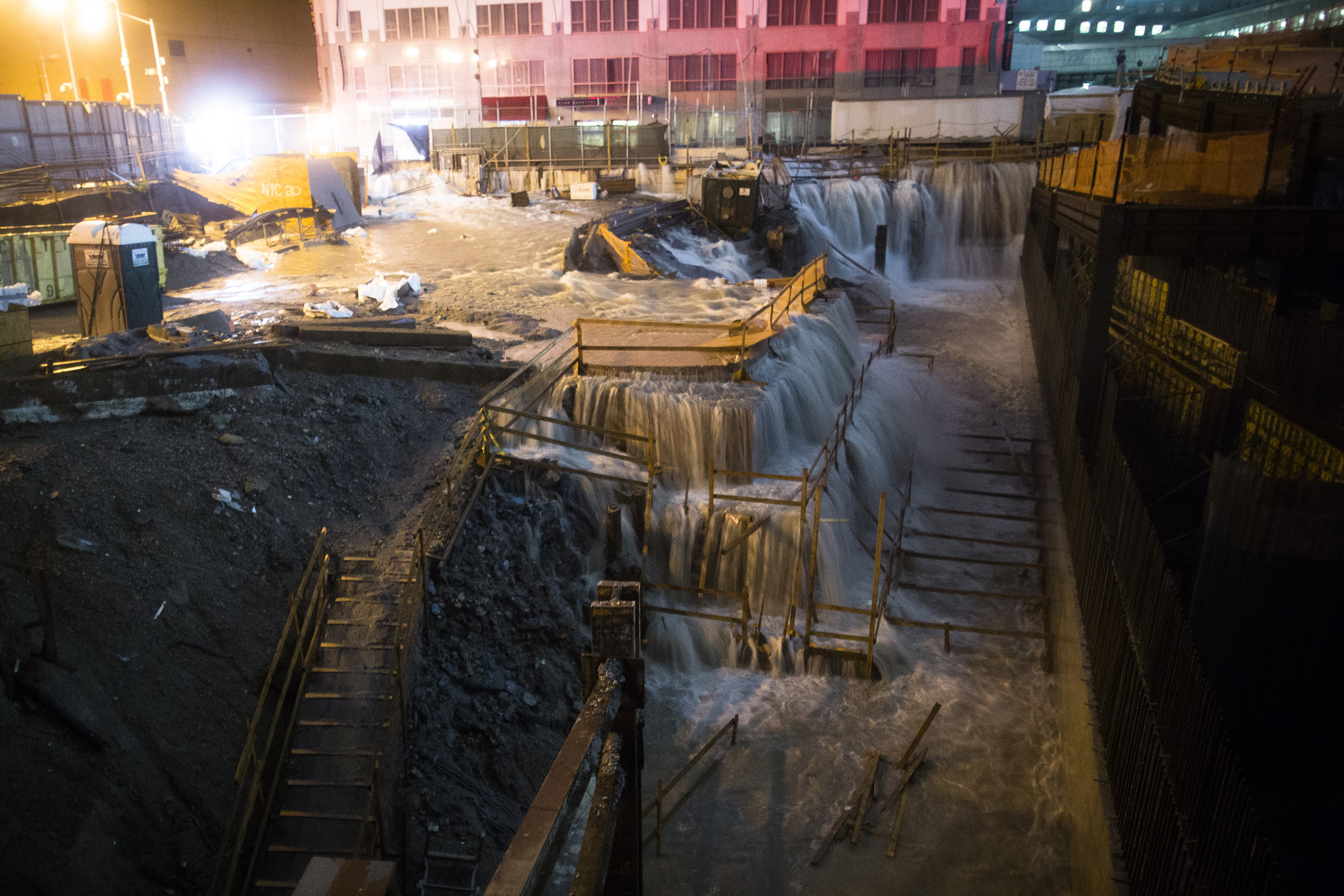 Seawater floods the ground zero construction site in New York City. The storm, which has spread rain and high winds from North Carolina to New England and west into Pennsylvania and upstate New York, continues to head northwest.