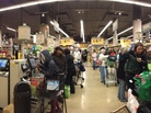 People wait to purchase groceries in self-checkout lanes at Safeway in Washington, D.C. People wait to purchase groceries in self-checkout lanes at Safeway in Washington, D.C.