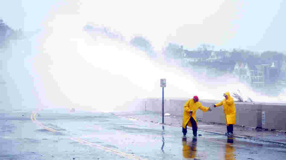 Waves crashed over a road in Winthrop, Mass., as Hurricane Sandy moved toward coastal areas Monday. Waves crashed over a road in Winthrop, Mass., as Hurricane Sandy moved toward coastal areas Monday.