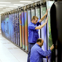 Cray employees put the finishing touches on Titan at the Department of Energy's Oak Ridge National Laboratory in Tennessee. The supercomputer may be the world's fastest. It's designed to do 20 petaflops — or 20,000 trillion calculations — each second. It consumes enough electricity to power a small city of 9,000 people.