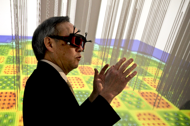 U.S. Energy Secretary Chu stands inside a 3-D imaging "cave," which simulates the inside of a nuclear reactor. The cave, powered by the supercomputers at Oak Ridge National Laboratory, helps scientists to process, view and understand enormous amounts of data visually.