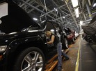 A worker installs carpet into a Jeep Liberty at the Toledo Assembly Complex in Toledo, Ohio, in 2011. A worker installs carpet into a Jeep Liberty at the Toledo Assembly Complex in Toledo, Ohio, in 2011.