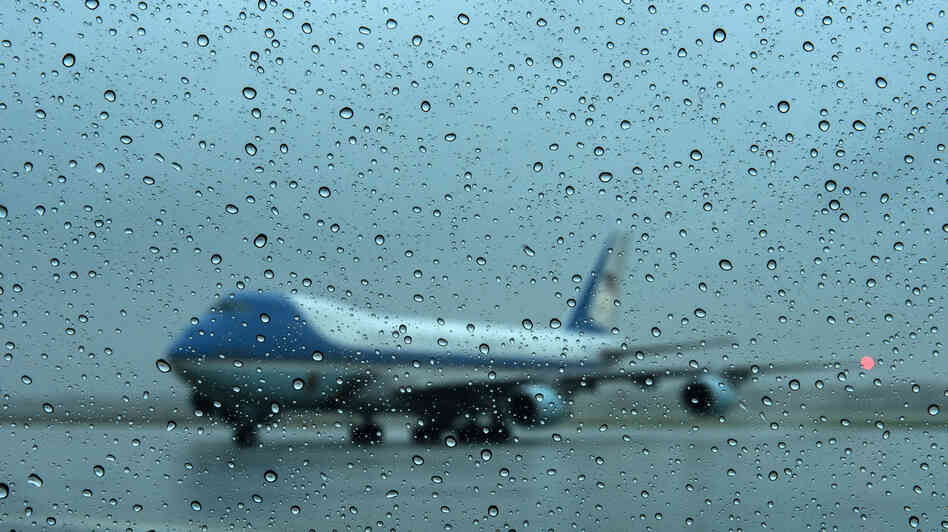 Air Force One arrives at Andrews Air Force Base in Maryland on Monday. President Obama returned from campaigning to monitor the storm.