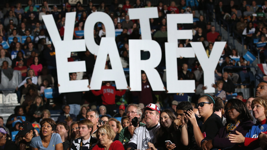 A crowd listens at a rally with former President Bill Clinton and Vice President Joe Biden in Youngstown, Ohio, on Monday. President Obama canceled his appearance to return to the White House to monitor Hurricane Sandy. Both campaigns have urged supporters whose states allow early voting to vote as soon as possible.