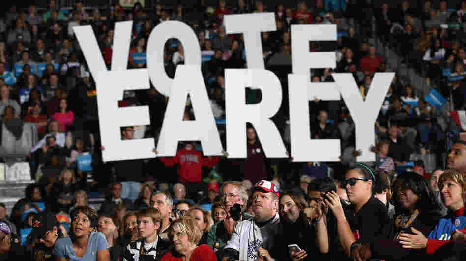 A crowd listens at a rally with former President Bill Clinton and Vice President Joe Biden in Youngstown, Ohio, on Monday. President Obama canceled his appearance to return to the White House to monitor Hurricane Sandy. Both campaigns have urged supporters whose states allow early voting to vote as soon as possible.