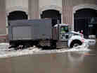 A truck drives through a flooded street caused by Hurricane Sandy in New York City's Financial District on Tuesday.