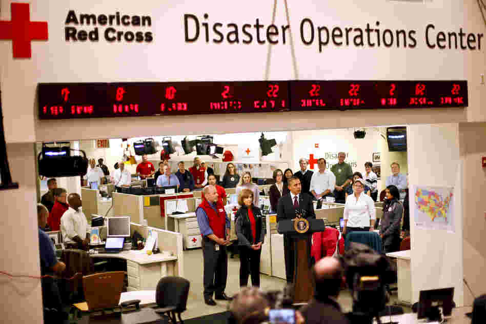 President Barack Obama visits the Red Cross Disaster Operation Center in Washington. He has declared New York and New Jersey "federal disaster areas."