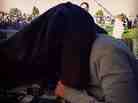 Reporting From the Campaign Trail: NPR Correspondent Ari Shapiro covers his head with a coat to block out noise and distraction as he talks with Host Audie Cornish on All Things Considered. http://bit.ly/RxHc6r 