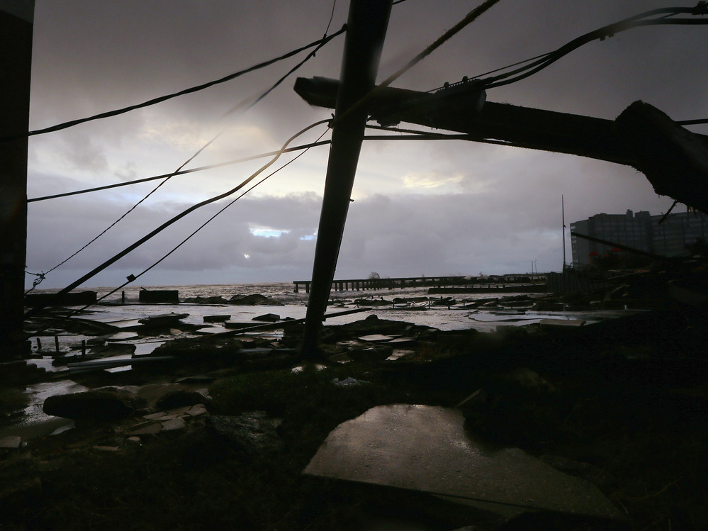 Debris and sections of a destroyed boardwalk in Atlantic City, N.J., earlier today.