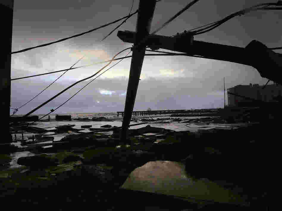Debris and sections of a destroyed boardwalk in Atlantic City, N.J., earlier today.