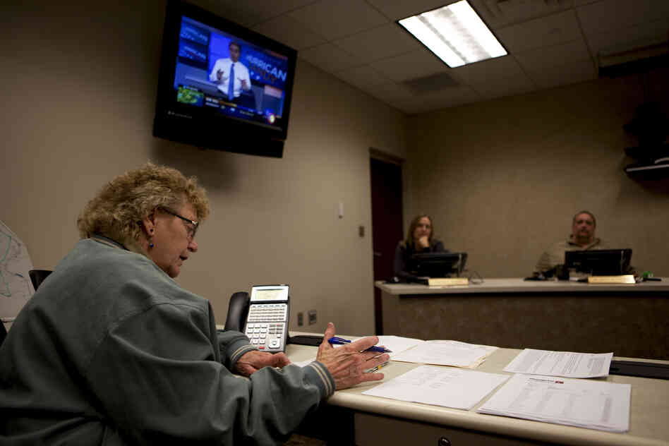 Marty Agee, director of the Raleigh County Emergency Operations Center, holds a conference call to make emergency plans for Sandy's arrival in the town of Beckley, W. Va., on Oct. 29.