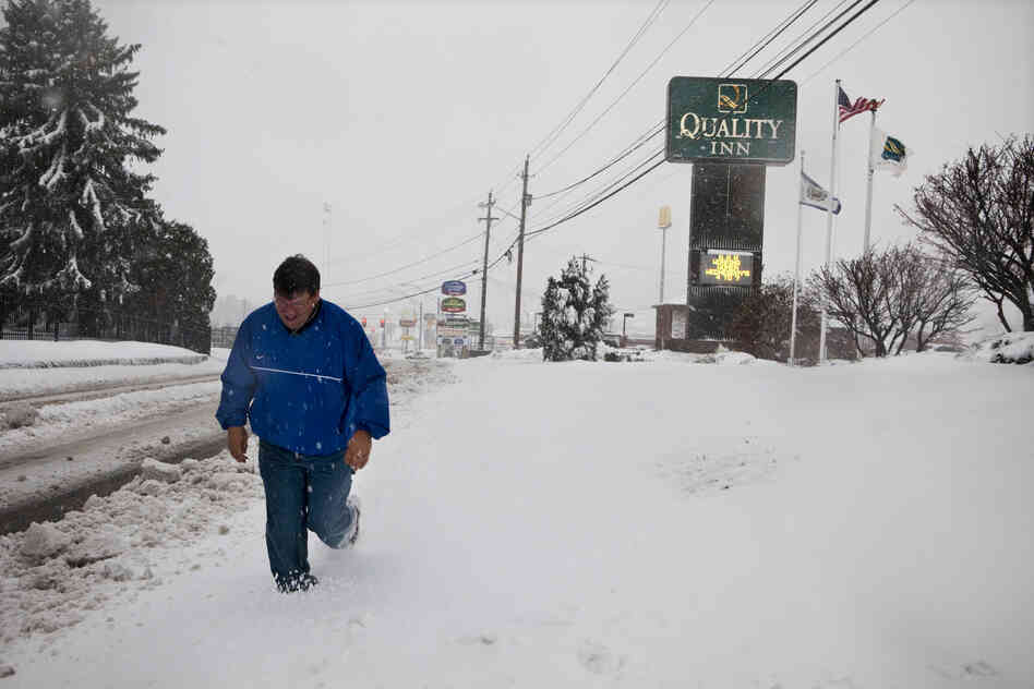 Todd Sargent, a resident of Beckley, heads out into the snow to distribute generators.