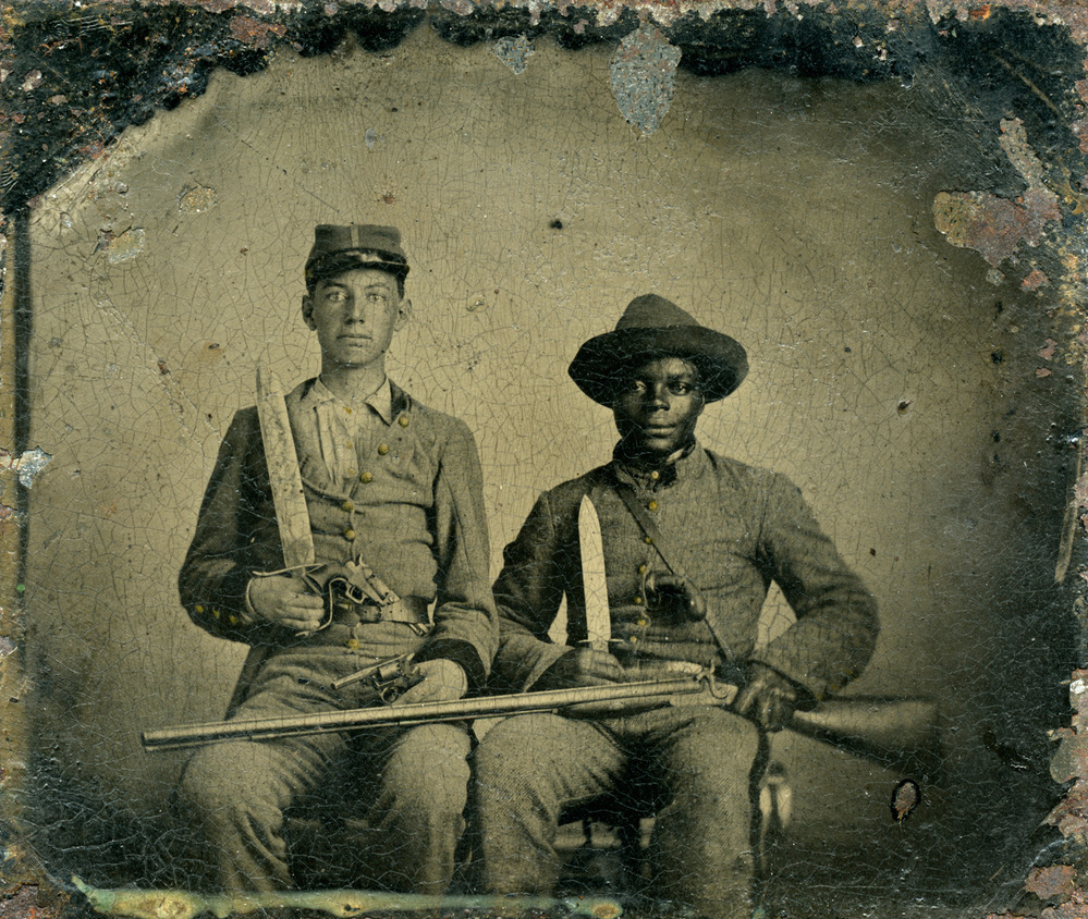 This rare portrait shows an identified Confederate noncommissioned officer, Sgt. Andrew Martin Chandler (left), and his named slave, Silas Chandler (right). It is the only Confederate photograph in the book by Rod Coddington, African American Faces of the Civil War. Born into slavery, Silas "was one of thousands of slaves who served as [body servants] during the war," writes Coddington.