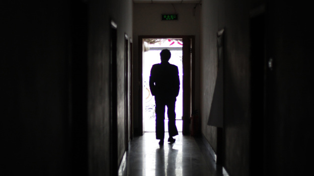A man walks through a former unofficial, or "black," jail in Beijing, in 2009. It's estimated that thousands of Chinese lodging protests against the government are illegally detained in secret sites such as this one, even though the government says they don't exist.