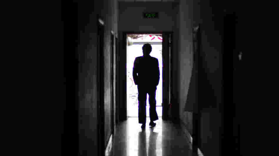 A man walks through a former unofficial, or "black," jail in Beijing, in 2009. It's estimated that thousands of Chinese lodging protests against the government are illegally detained in secret sites such as this one, even though the government says they don't exist.