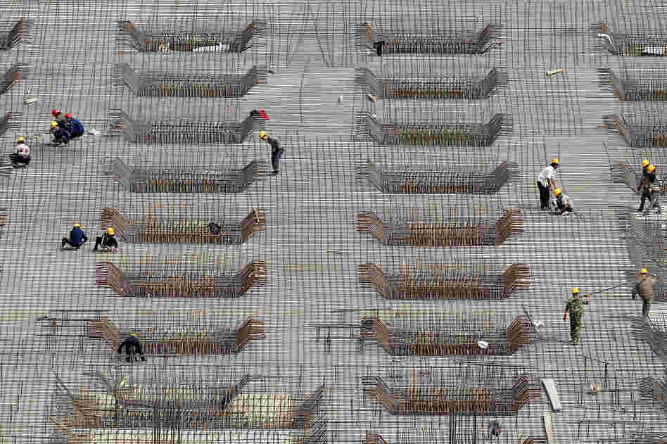 China's rapid expansion has been fueled in part by massive construction projects, like this one in Beijing, shown last year. But many economists say the Chinese economic model is unlikely to produce the same explosive growth in the coming years and needs to be revamped.