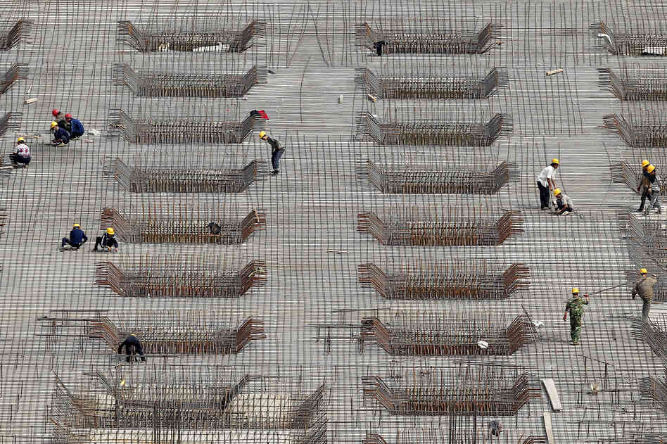 China's rapid expansion has been fueled in part by massive construction projects, like this one in Beijing, shown last year. But many economists say the Chinese economic model is unlikely to produce the same explosive growth in the coming years and needs to be revamped.