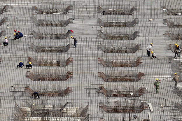 China's rapid expansion has been fueled in part by massive construction projects, like this one in Beijing, shown last year. But many economists say the Chinese economic model is unlikely to produce the same explosive growth in the coming years and needs to be revamped.