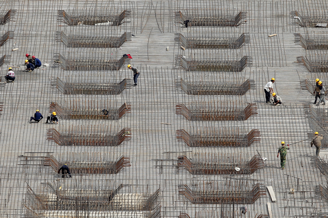 China's rapid expansion has been fueled in part by massive construction projects, like this one in Beijing, shown last year. But many economists say the Chinese economic model is unlikely to produce the same explosive growth in the coming years and needs to be revamped.