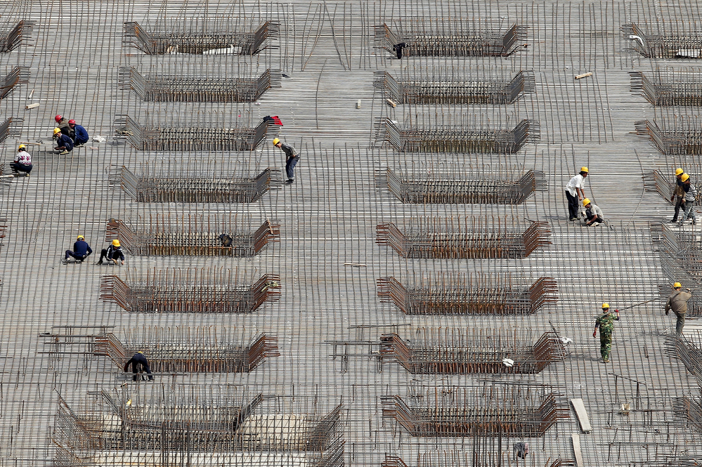 China's rapid expansion has been fueled in part by massive construction projects, like this one in Beijing, shown last year. But many economists say the Chinese economic model is unlikely to produce the same explosive growth in the coming years and needs to be revamped.
