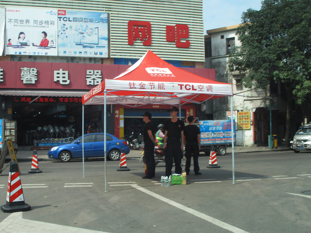 Police stand on watch on the streets of Shaxi, China, following three days of riots in June.