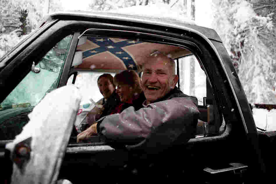 From left, Dale McKey, Karin McKey and George Secrist return home from an outing into the snow on Tuesday. From left, Dale McKey, Karin McKey and George Secrist return home from an outing into the snow on Tuesday.