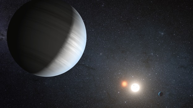 This artist's concept illustrates Kepler-47, the first transiting circumbinary system — multiple planets orbiting two suns — 4,900 light-years from Earth, in the constellation Cygnus.