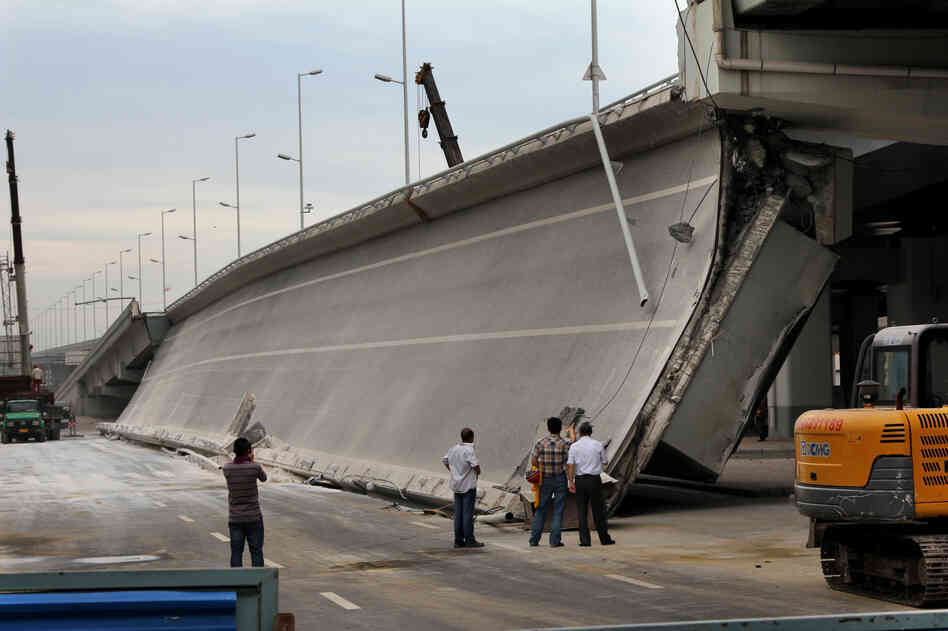 Eight bridges have collapsed around China since 2011. Here, government investigators examine a recently built entrance ramp that collapsed this summer in the northeastern city of Harbin, killing three people. Local residents believe government corruption and substandard materials are to blame.