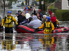 First responders rescue flood-stranded people in Little Ferry, N.J., on Tuesday. First responders rescue flood-stranded people in Little Ferry, N.J., on Tuesday.