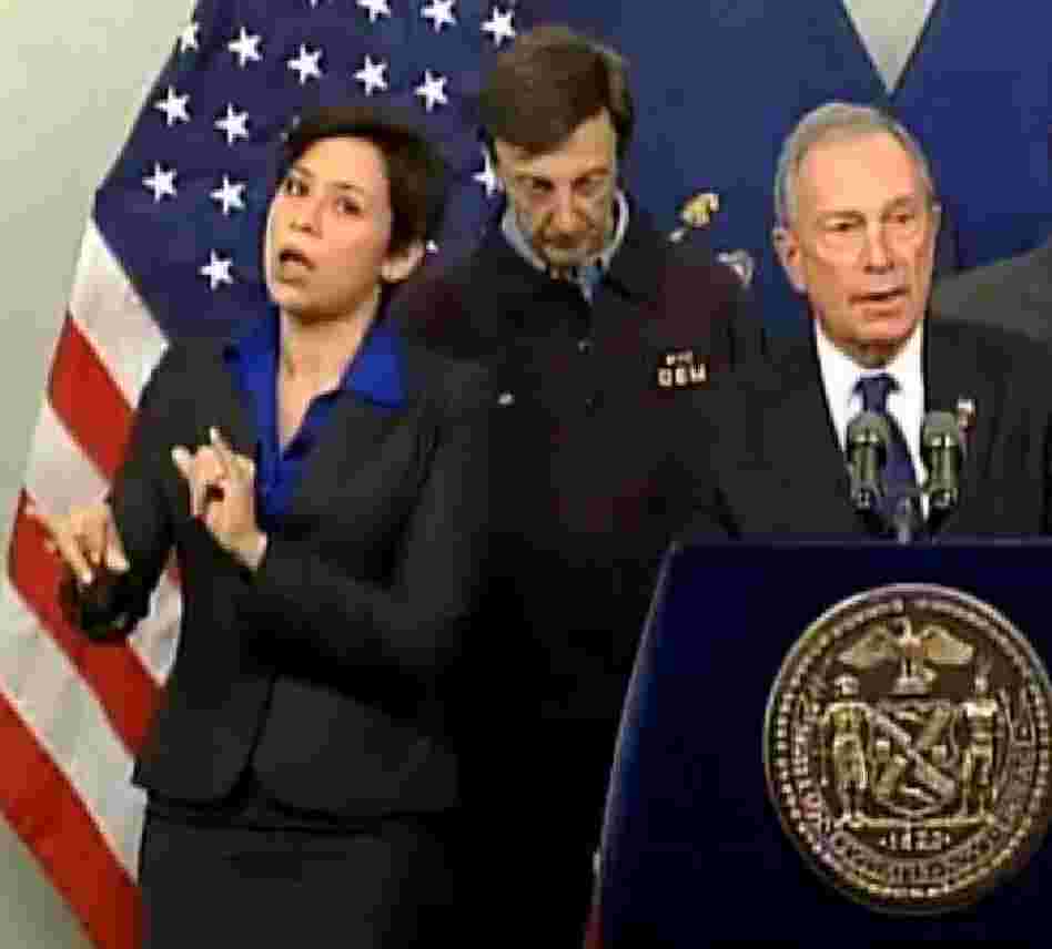 Fans like her style: Mayor Michael Bloomberg (at right) briefing New Yorkers about Hurricane Sandy on Monday. At left is his sign language interpreter, who the mayor identified as Lydia Callis.