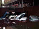 In New York City's financial district, cars floated in a flooded subterranean basement a day after Hurricane Sandy tore across the East Coast.