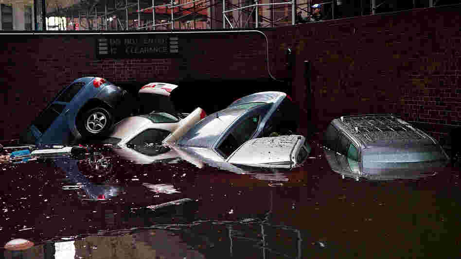 In New York City's financial district, cars floated in a flooded subterranean basement a day after Hurricane Sandy tore across the East Coast. In New York City's financial district, cars floated in a flooded subterranean basement a day after Hurricane Sandy tore across the East Coast.