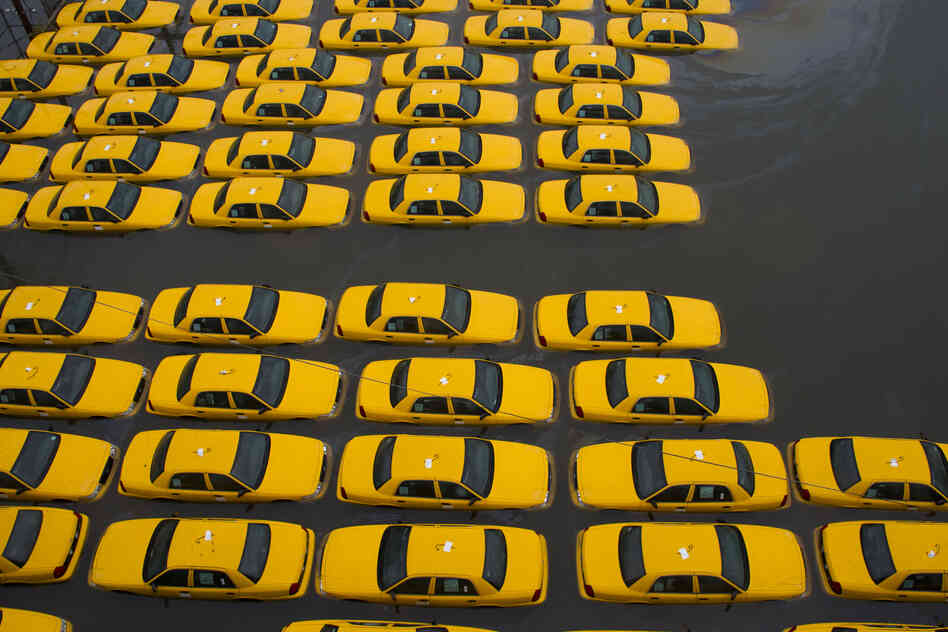 A parking lot full of yellow cabs is flooded as a result of Hurricane Sandy in Hoboken, N.J.