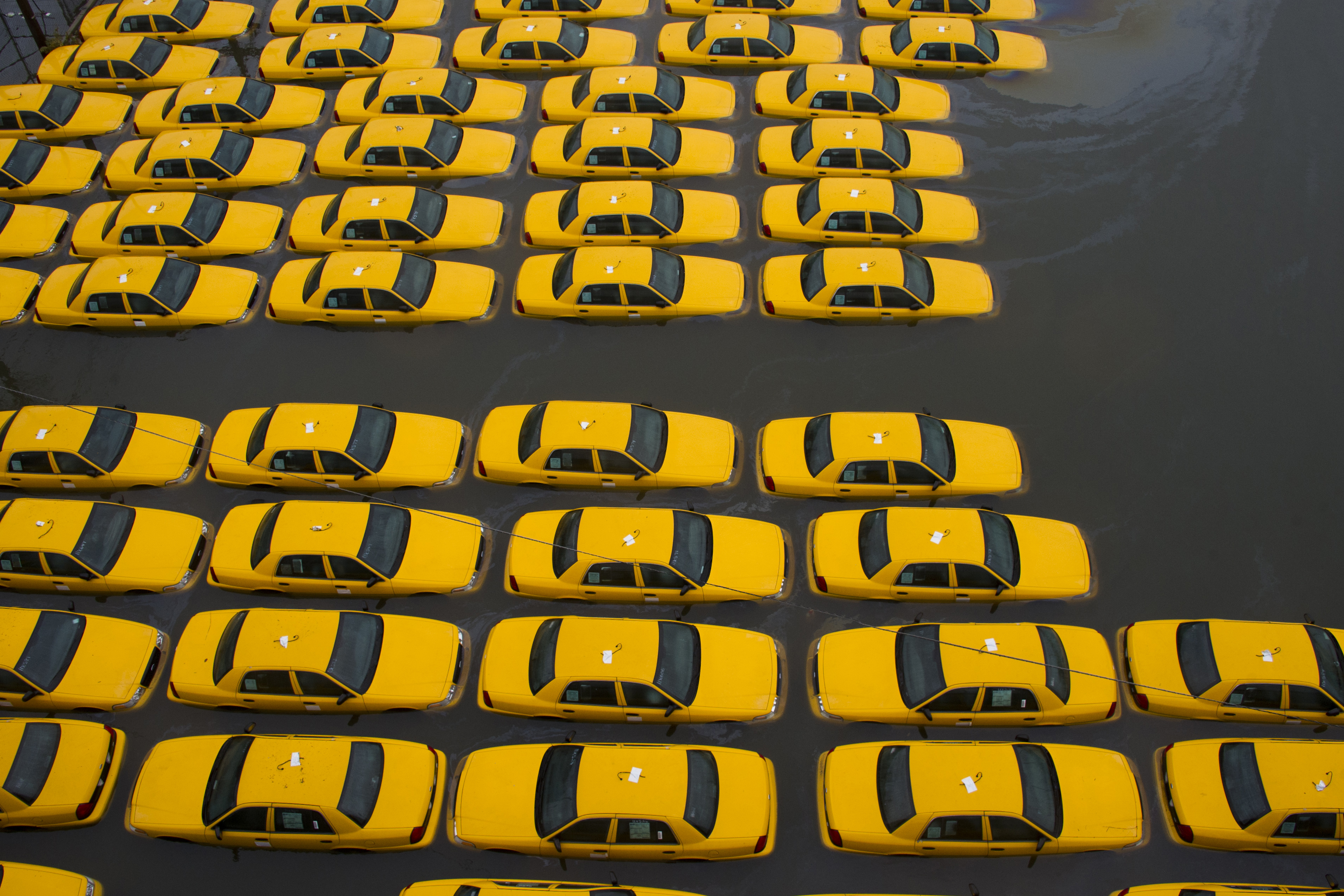 A parking lot full of yellow cabs is flooded as a result of Hurricane Sandy in Hoboken, N.J.