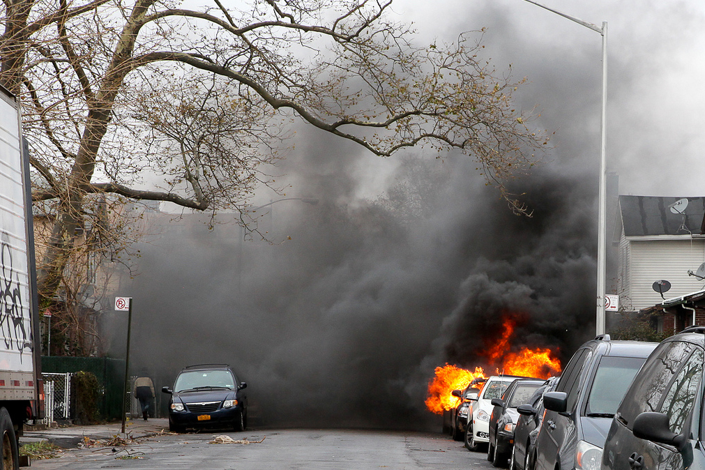 A car is seen on fire in the Brighton Beach neighborhood of Brooklyn, N.Y.