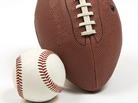 A baseball hugging a football. A baseball hugging a football.