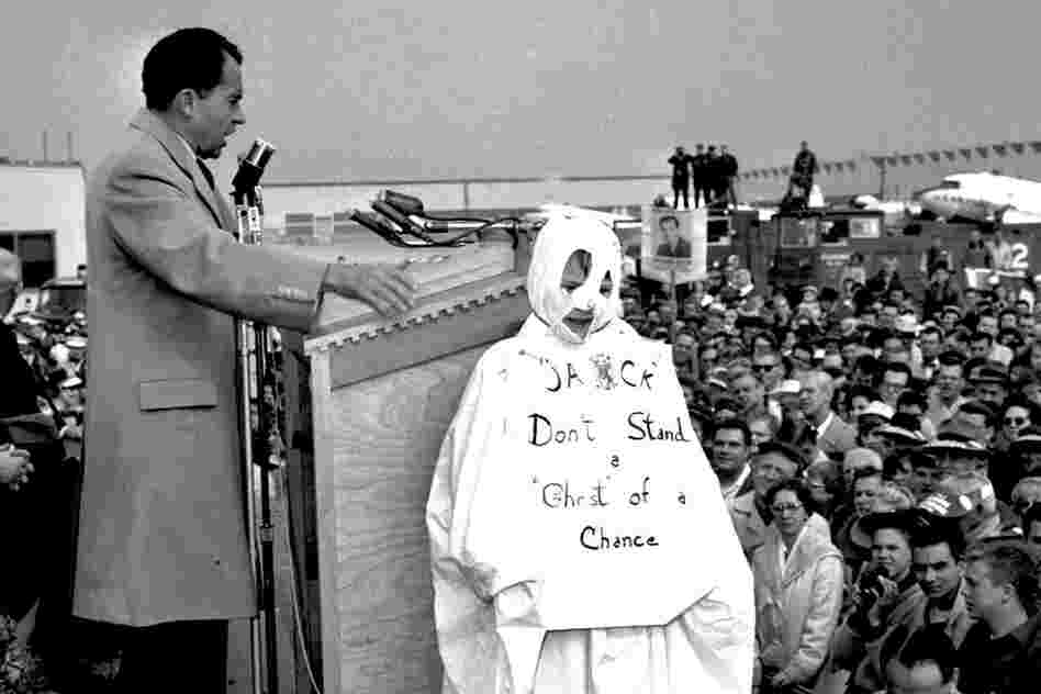 Richard Nixon addresses a crowd while campaigning for president against John F. Kennedy in 1960. To his right is 10-year-old Tom Lemke, in a ghost costume that reads "Jack Don't Stand a Ghost of a Chance," referring to Kennedy. Nixon called attention to the boy when he saw him in the crowd. So, moral of the story: Wearing a costume can make you famous.