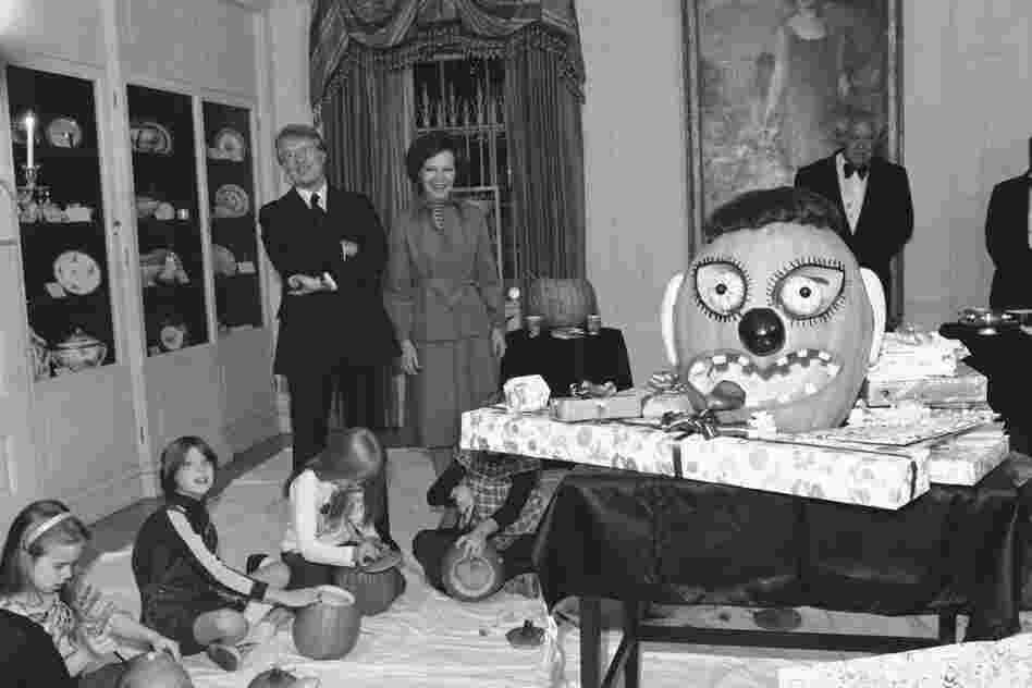 President Jimmy Carter and first lady, Rosalynn, watch their daughter, Amy, and her friends carve pumpkins for Amys 10th birthday party. (One of many reasons why it pays to have friends with October birthdays.)