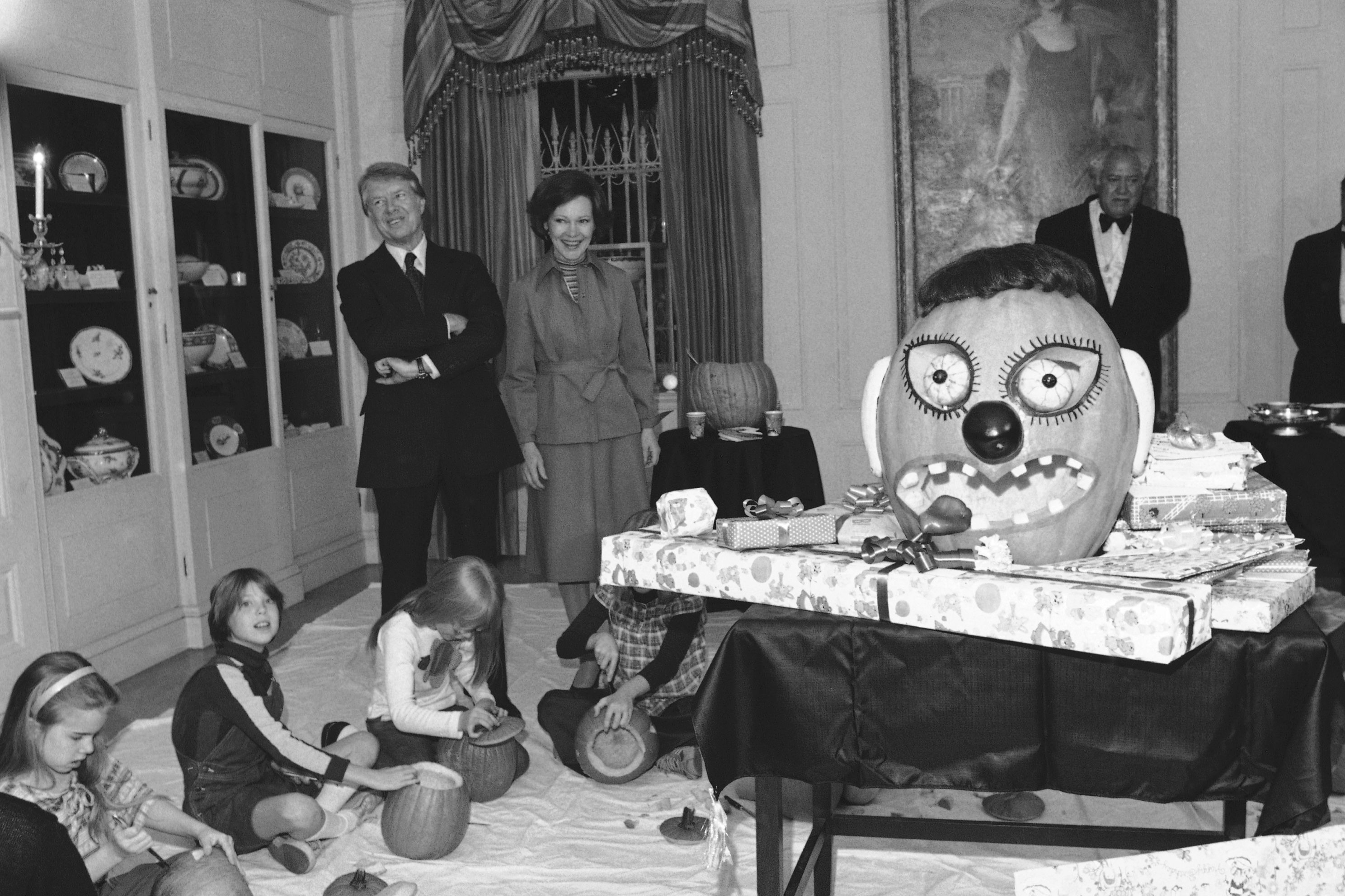 President Jimmy Carter and first lady, Rosalynn, watch their daughter, Amy, and her friends carve pumpkins for Amys 10th birthday party. (One of many reasons why it pays to have friends with October birthdays.)