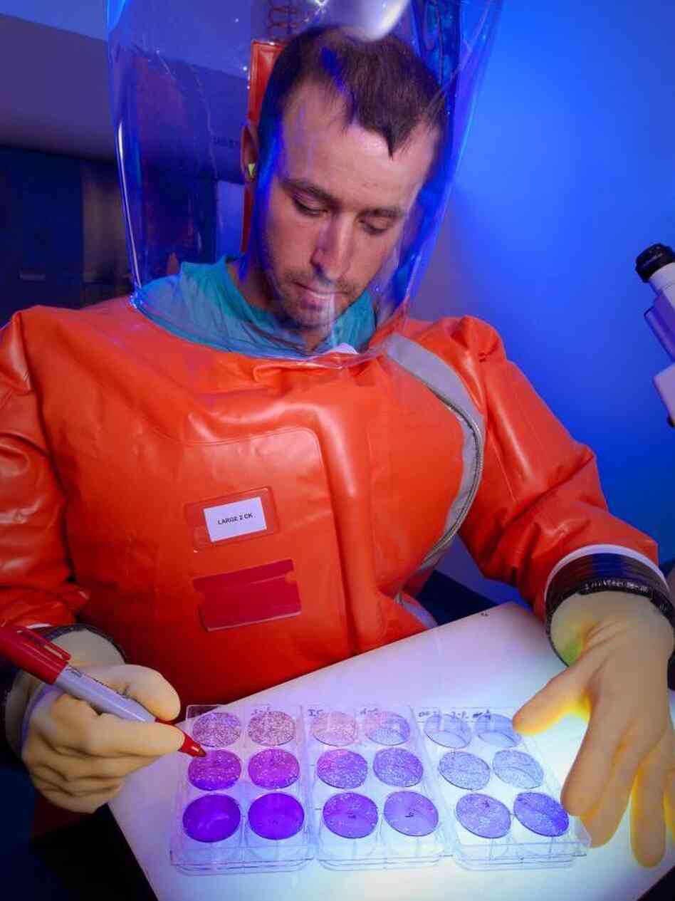A microbiologist runs an experiment to count hemorrhagic fever viruses at the Centers of Disease Control and Prevention.