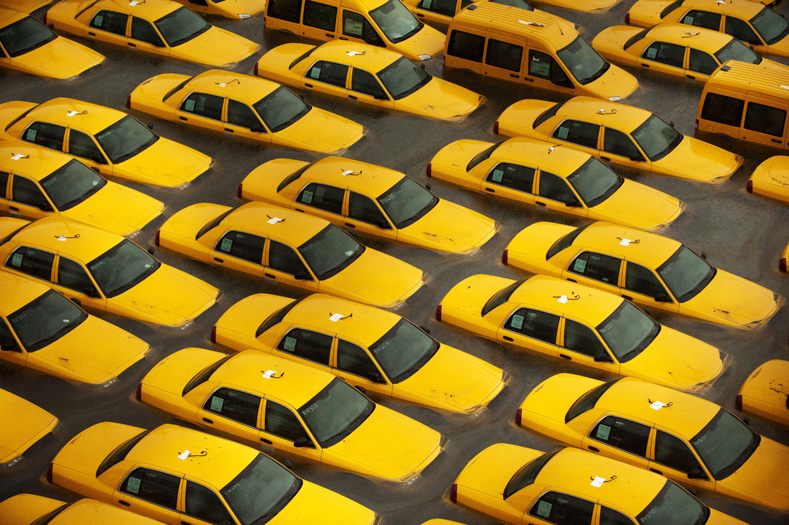 Taxis sit in a flooded lot in Hoboken, N.J., after Hurricane Sandy caused massive flooding across much of the Atlantic Seaboard.