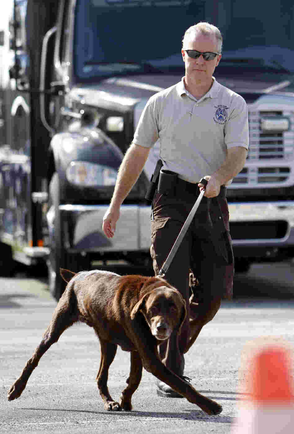 Miami-Dade Detective Douglas Bartelt and narcotics detector canine Franky give a demonstration in Miami in 2011.