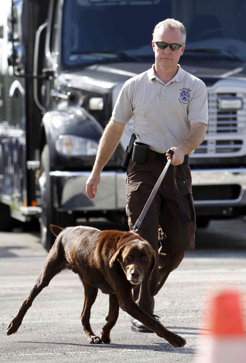 Miami-Dade Detective Douglas Bartelt and narcotics detector canine Franky give a demonstration in Miami in 2011.